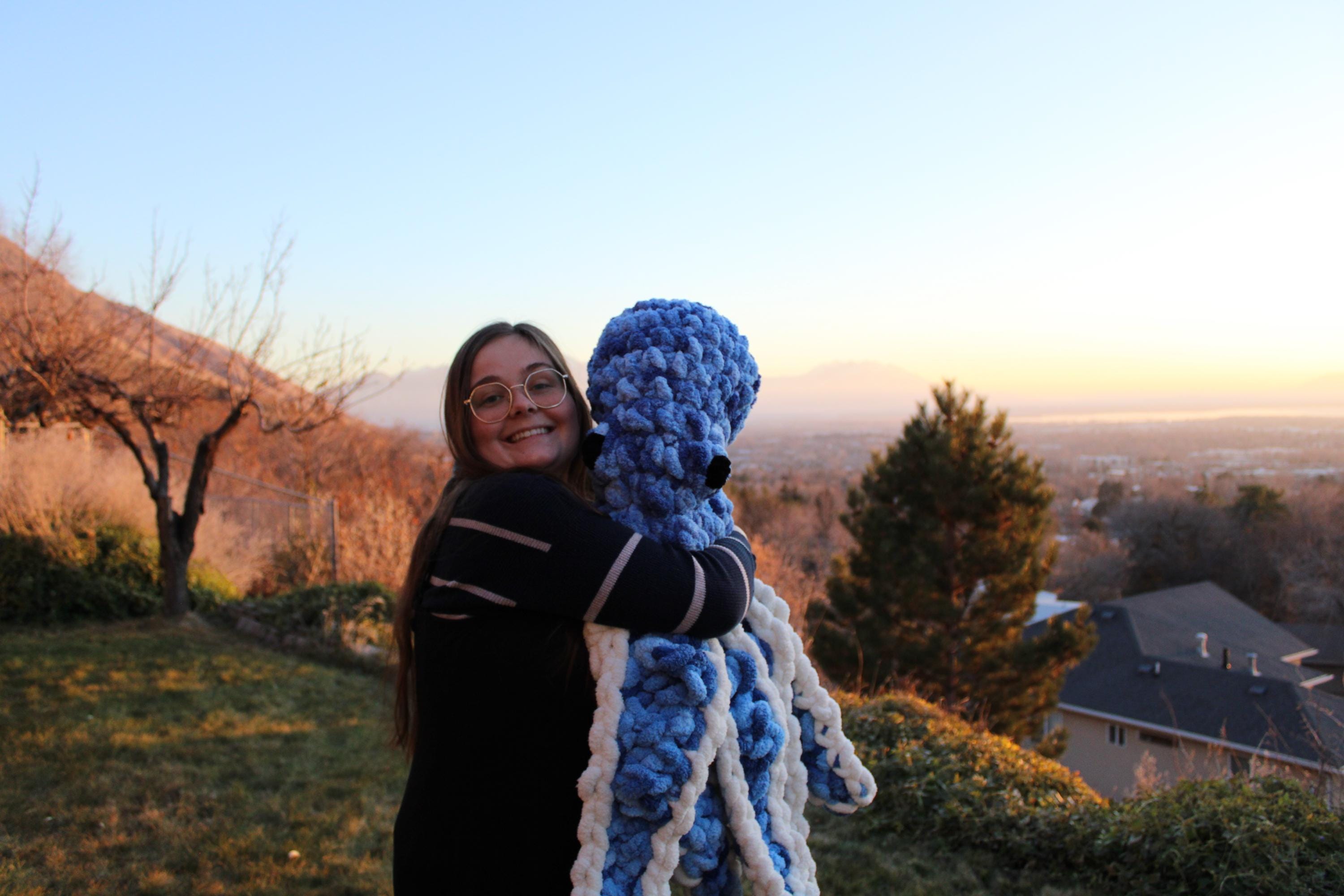 Giant crochet octopus at sunset
